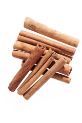 Cinnamon sticks isolated on white background, close up