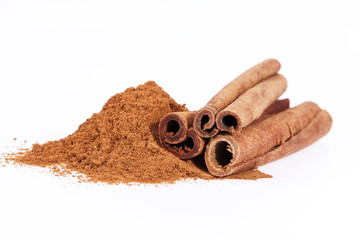 Cinnamon sticks and powder isolated on white background