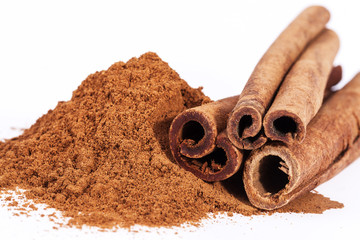 Cinnamon sticks and powder isolated on white background