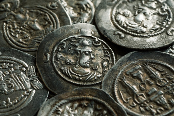 Pile of ancient silver coins close-up