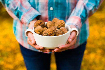 Walnuts in the hands of the girls.