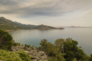 Fototapeta na wymiar Cloudy morning landscape of a coast in Croatia 