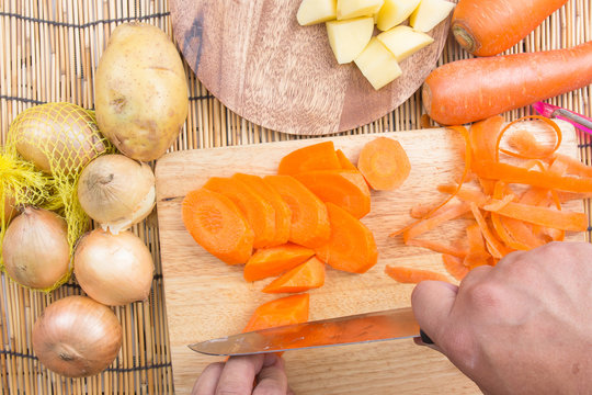 Chef is cutting carrots