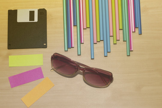 Office desk with group of pencil,glass,diskett and lens,group of note,colorful of note,
