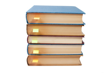 stack of books with bookmarks