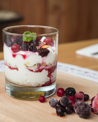 Greek yogurt with cereal, jam and fruits