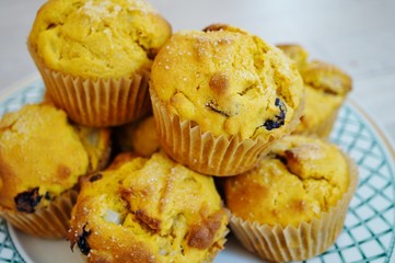 Platter of homemade vegan pumpkin muffins with pears and dried cherries