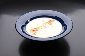 Milk soup with noodles in a ceramic bowl