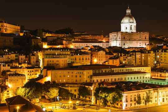 Lisbon by night. Portugal skyline at Alfama with the oldest district of the city and the famous National Pantheon.