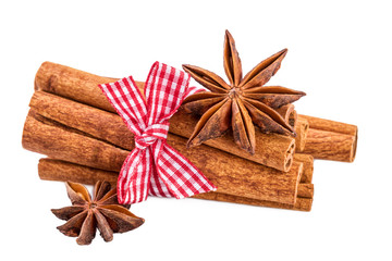 Cinnamon sticks bundle and anise over white.Traditional Christmas spices isolated on white.