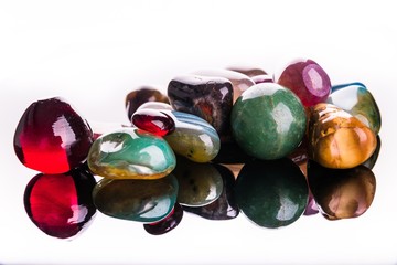 Collection of Colorful Semiprecious Gemstones on White Background.
