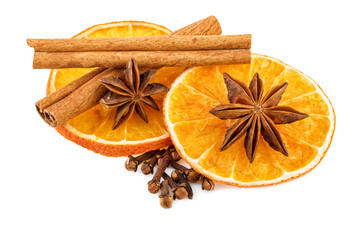 Dried orange slices with cloves and cinnamon sticks. Traditional Christmas spices isolated on white.