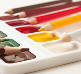 colored pencils and watercolor paints
