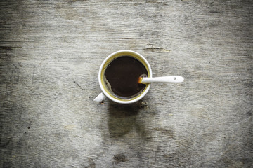Coffee cup top view on wooden table background