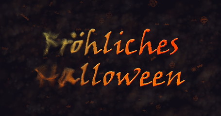 Frohliches Halloween text in German dissolving into dust to left.