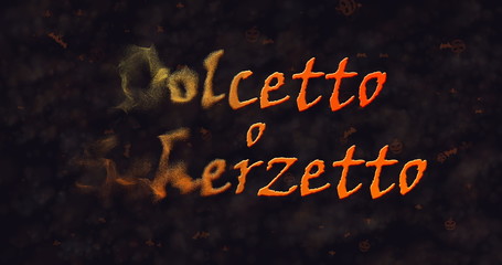 Dolcetto o Schezetto (Trick or Treat) Italian text dissolving into dust from left.