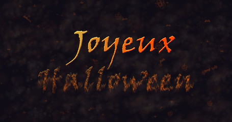 Joyeux Halloween text in French dissolving into dust to bottom.