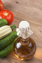 vegetables and a bottle of oil, still life