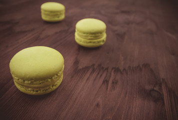 green cake macaron on wood background, maccarone sweet dessert
