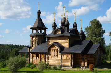 Fototapeta na wymiar Wooden church of All Saints of Siberia on the Tura river. Verkhoturie. Sverdlovsk region. Russia.