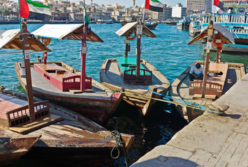 Fototapeta na wymiar Traditional Abra ferries at the creek in Dubai, United Arab Emir