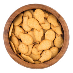 Cracker in a wooden bowl isolated on white background.