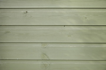 A whole page of green stained wooden fence background texture 
