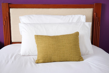 Fototapeta na wymiar White bed sheets and pillows