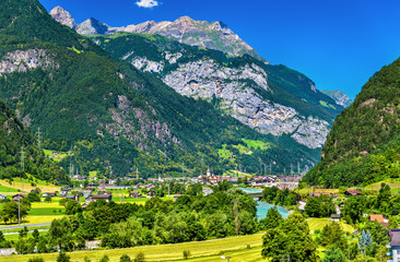 View of Erstfeld, a village in Swiss Alps - obrazy, fototapety, plakaty
