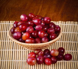 grape isolated on wooden background.