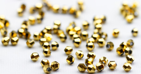 Golden glass beads