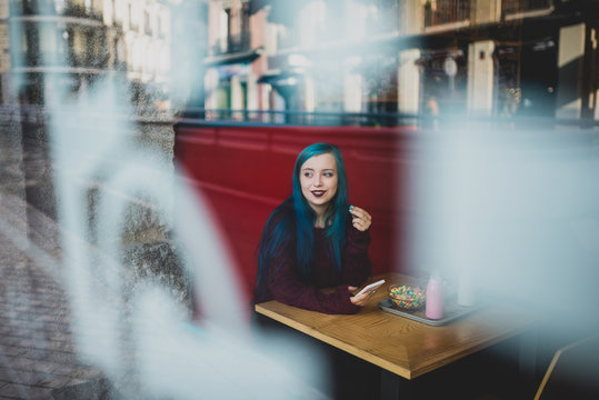 Girl sitting in beanery.