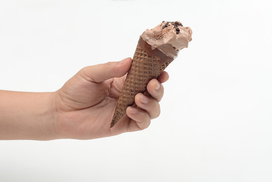 Hand Holding Bitten Ice Cream Cone On White Background