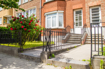 House entrance with flowers on the yard in Brussels, Belgium