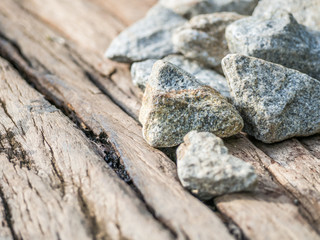 Closeup of cracked wooden and gravel background
