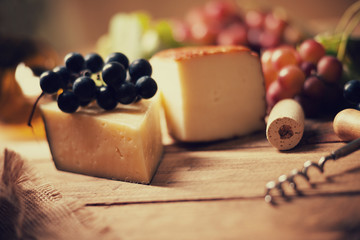 Cheese, grape and wine cork 
