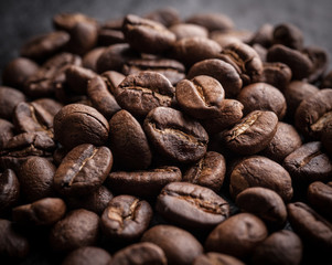 roasted coffee beans on dark background, can be used as a background