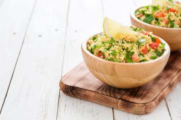 Tabbouleh salad with couscous on a white table

