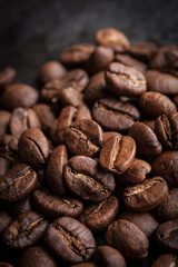 roasted coffee beans on dark background, can be used as a background