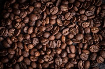 roasted coffee beans on dark background, can be used as a background