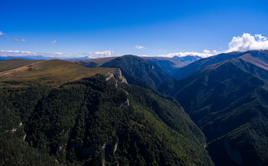 Mountain valley and a blue sky.