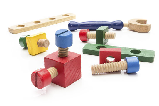 Wooden toy building blocks on white background.