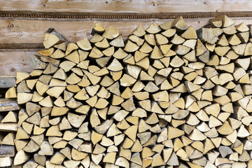 Firewood Stacked at wall of house