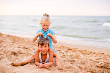 Naklejka premium two children playing on beach