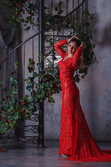 Fototapeta na wymiar Girl in red dress enthralling