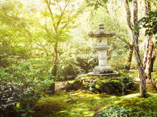 Vintage Japanese stone lantern in garden