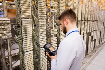 Technician using digital cable analyzer