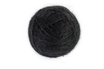 Black ball of knitting yarn. On white, isolated background.