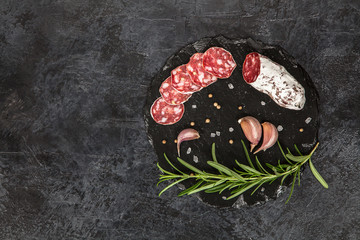 Salami on dark background