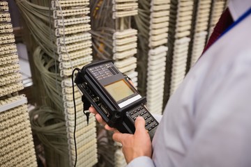 Technician using digital cable analyzer